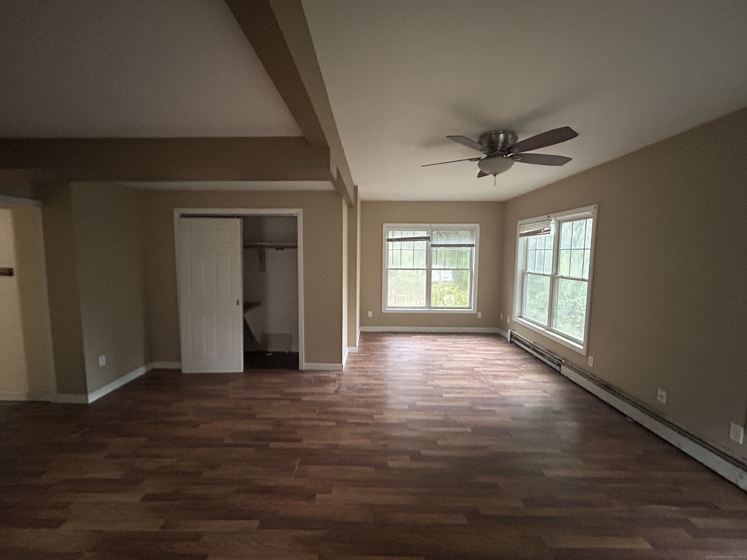 53 Falls Bashan Road East Haddam, CT 06469 - Photo 10 of 32 a view of an empty room with a window and wooden floor