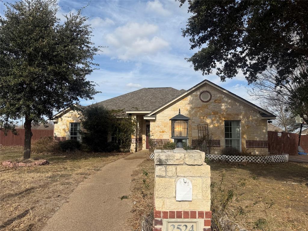View of front of house featuring stone siding