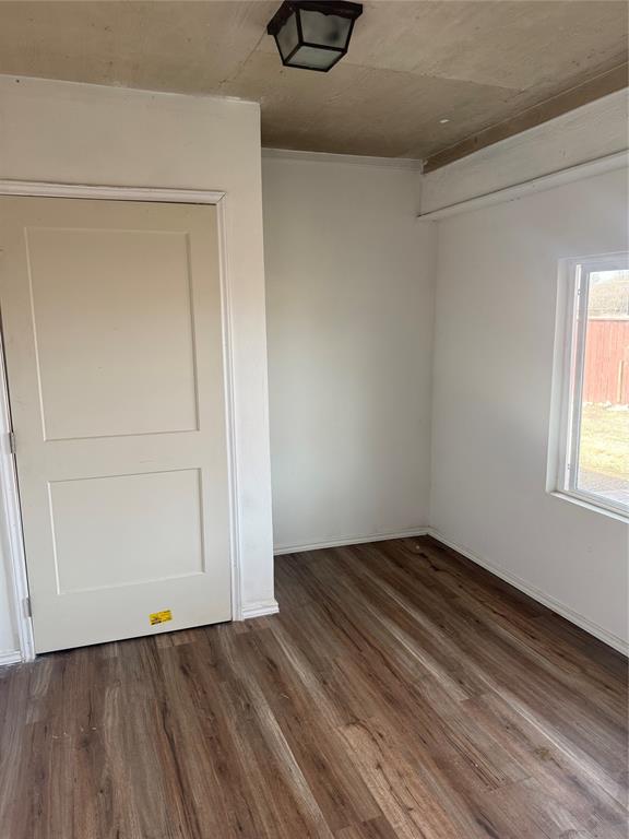 2524 Riders Way Woodway, TX 76712 - Photo 14 of 35 Spare room with dark wood-type flooring and baseboards
