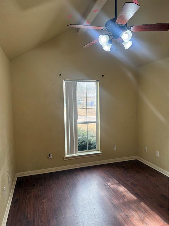2524 Riders Way Woodway, TX 76712 - Photo 22 of 35 Additional living space with dark wood-style flooring, vaulted ceiling with beams, and ceiling fan