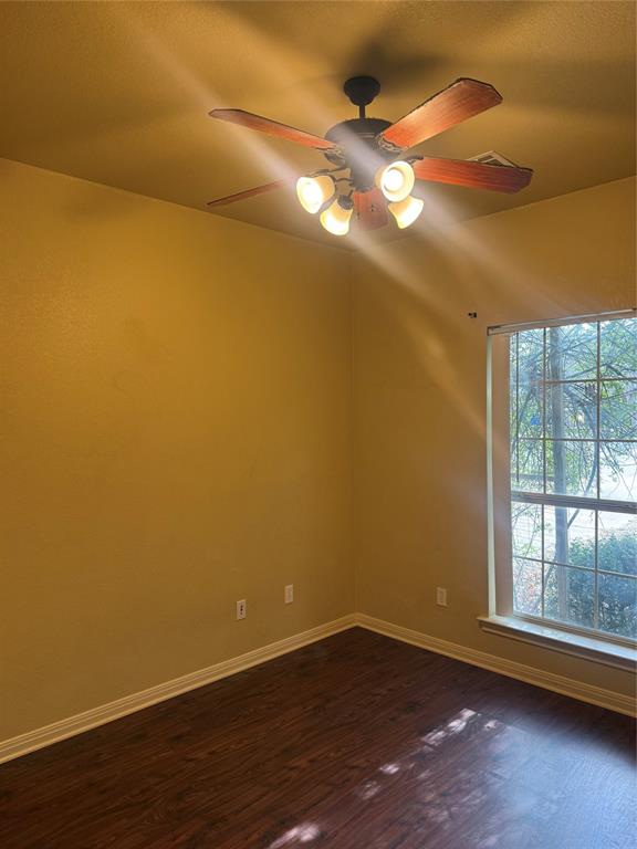 2524 Riders Way Woodway, TX 76712 - Photo 24 of 35 Unfurnished room featuring dark wood-style floors and ceiling fan