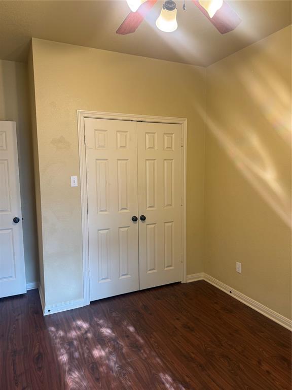 2524 Riders Way Woodway, TX 76712 - Photo 27 of 35 Additional living space featuring dark wood-style flooring and a ceiling fan