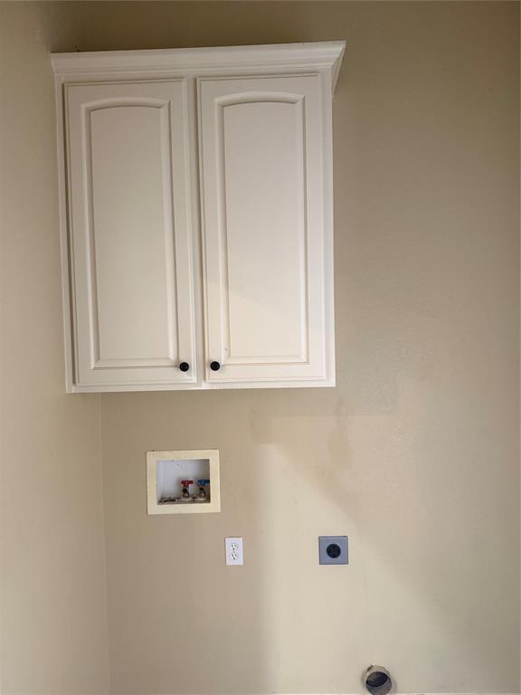 2524 Riders Way Woodway, TX 76712 - Photo 32 of 35 Laundry room featuring hookup for a washing machine, cabinet space, and hookup for an electric dryer