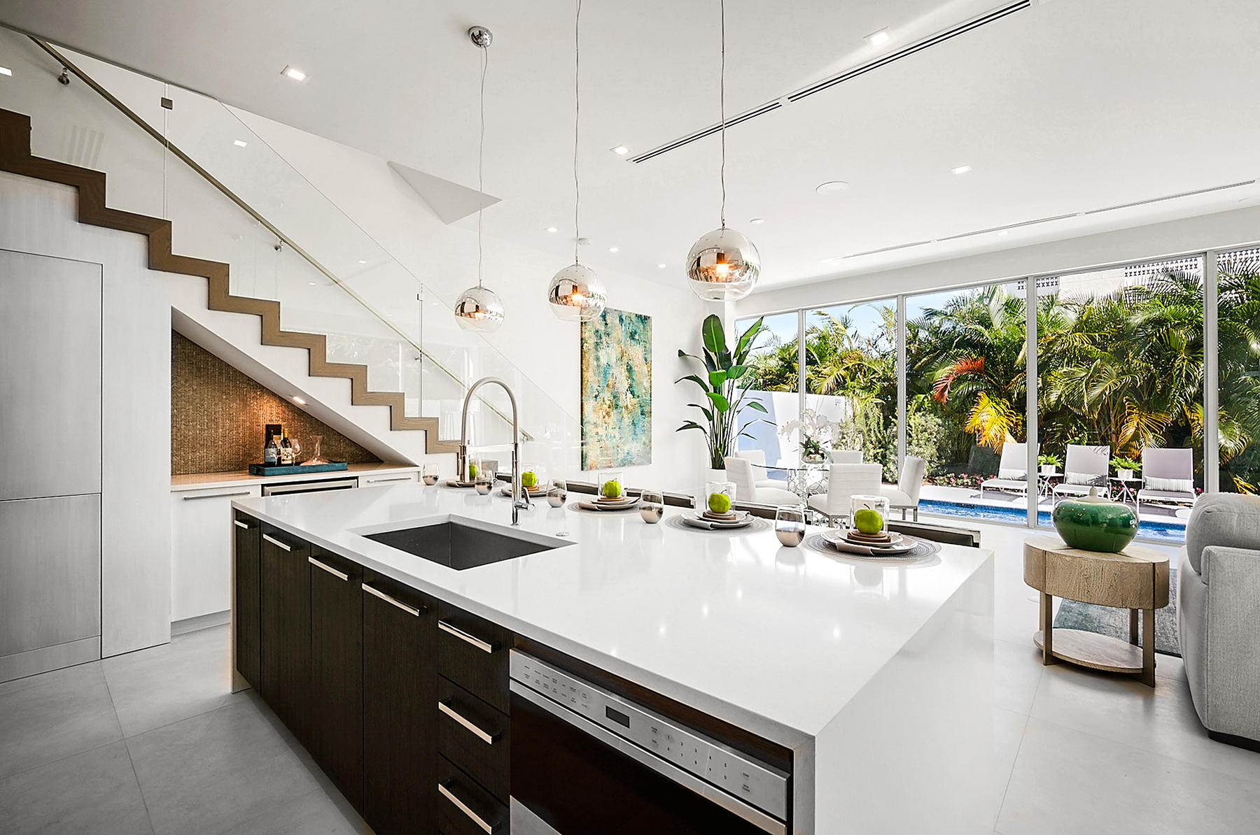 3092 Banyan Road, Unit A Boca Raton, FL 33432 - Photo 15 of 49 a kitchen with sink a large window and chairs