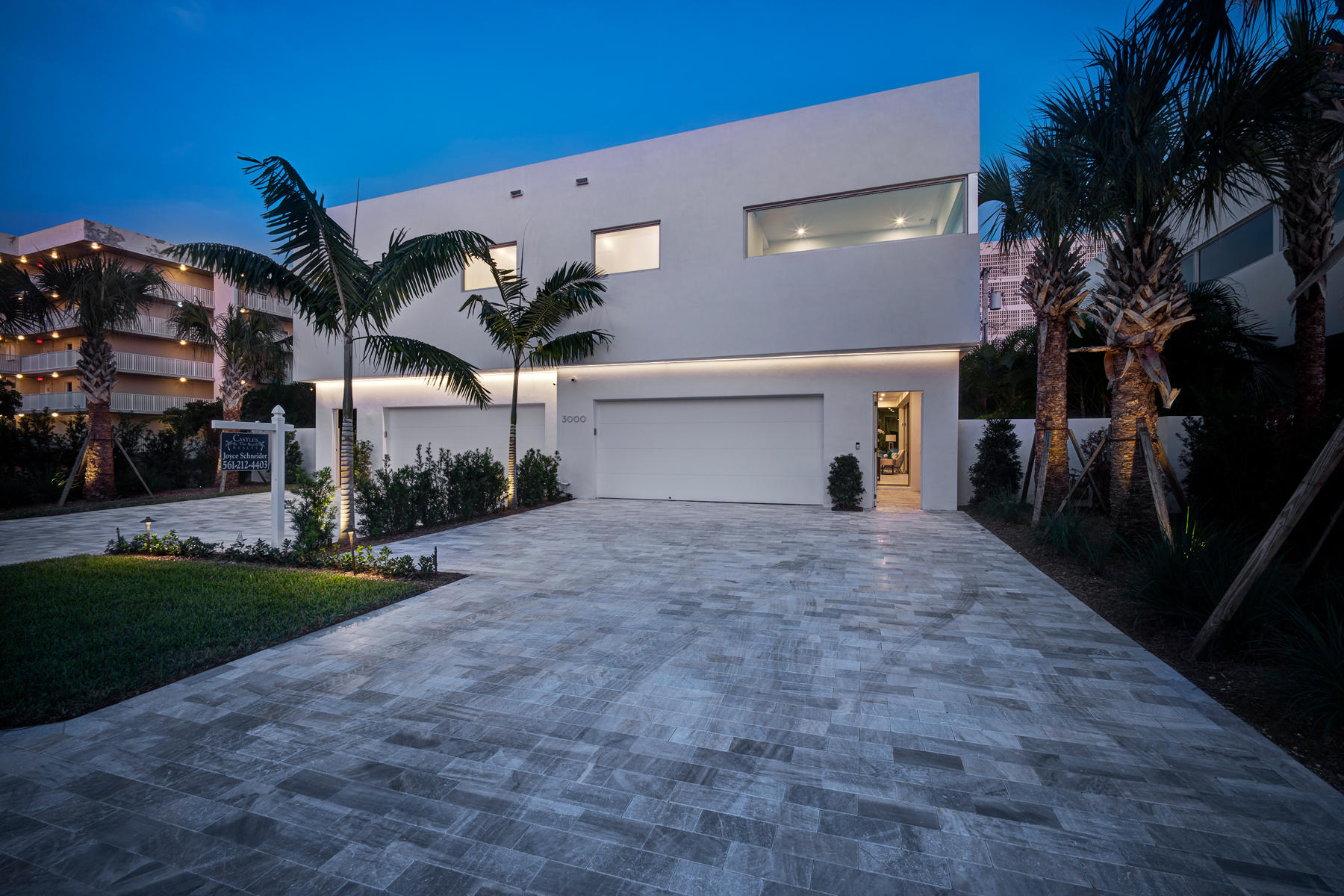 3092 Banyan Road, Unit A Boca Raton, FL 33432 - Photo 3 of 49 a view of a house with a yard and a garage