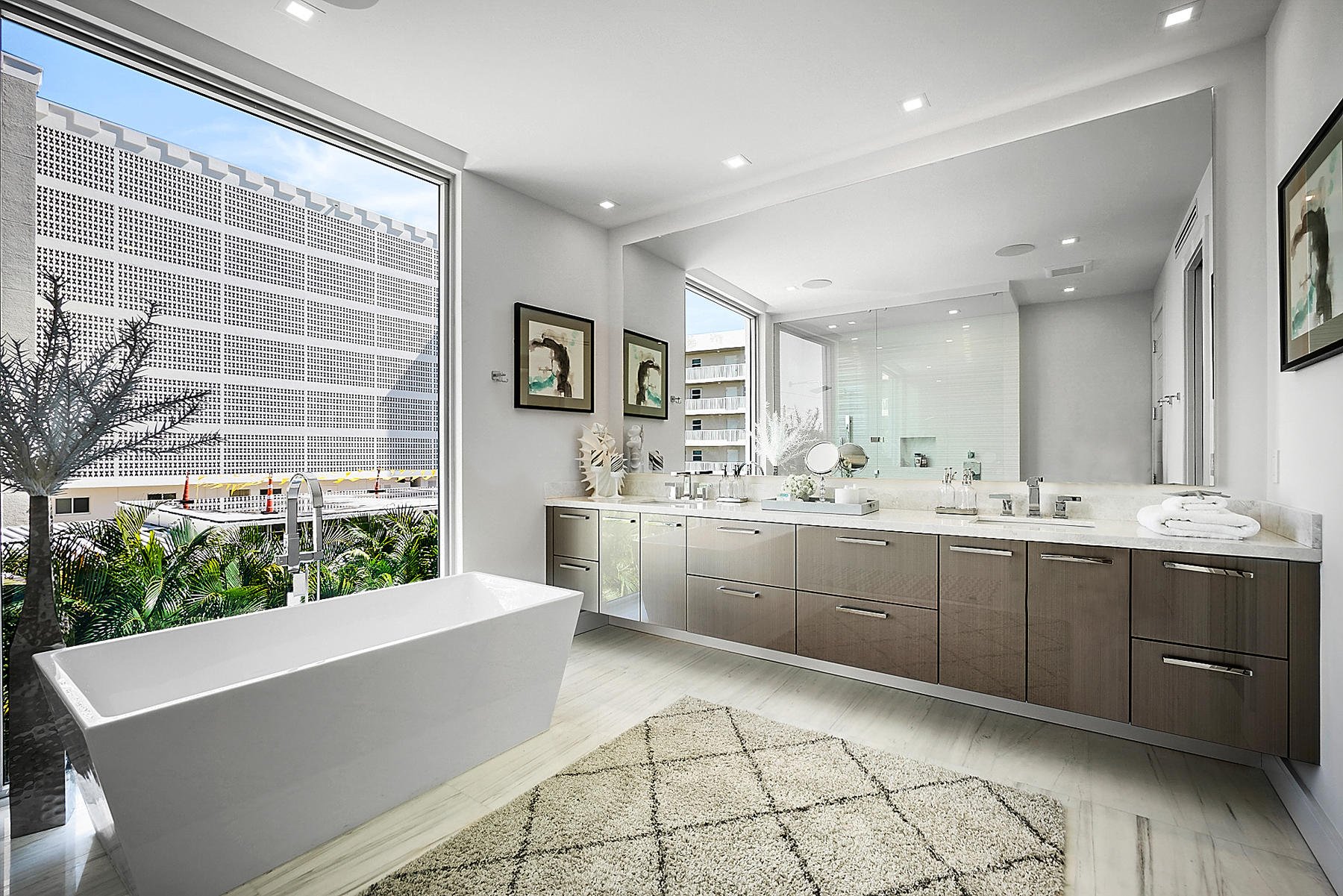 3092 Banyan Road, Unit A Boca Raton, FL 33432 - Photo 34 of 49 a large bathroom with a large tub and sink