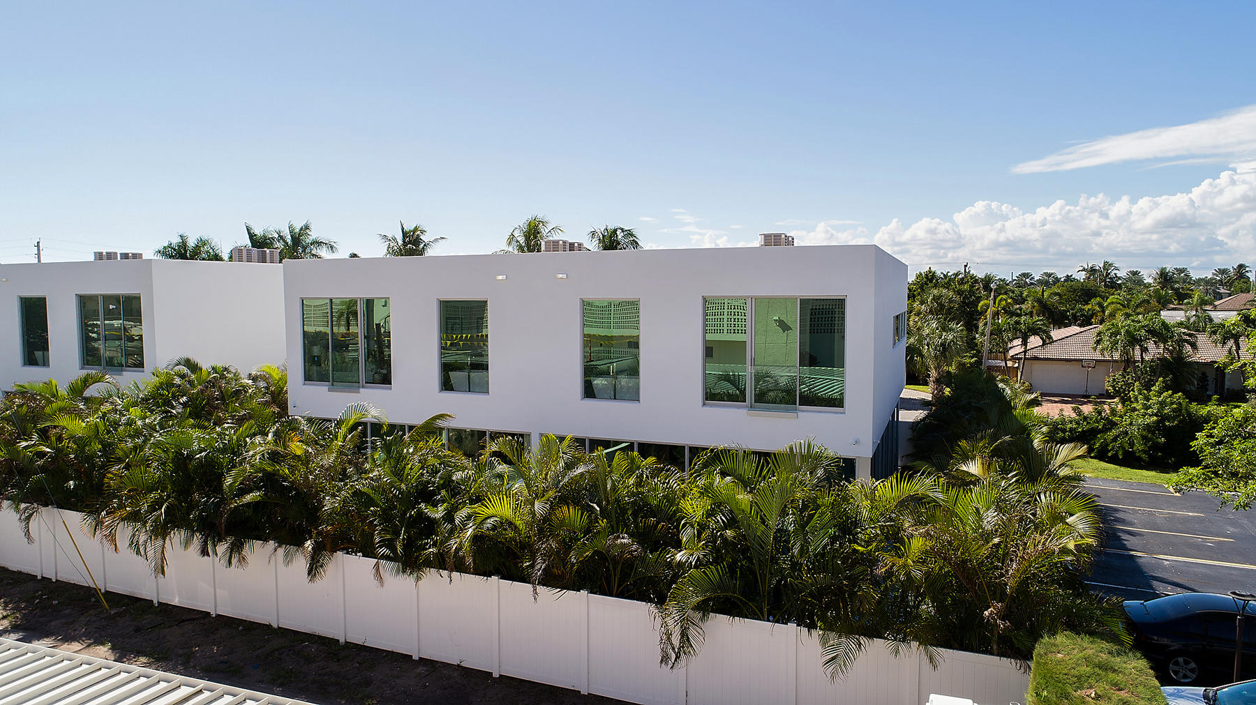 3092 Banyan Road, Unit A Boca Raton, FL 33432 - Photo 41 of 49 a front view of a house with a yard