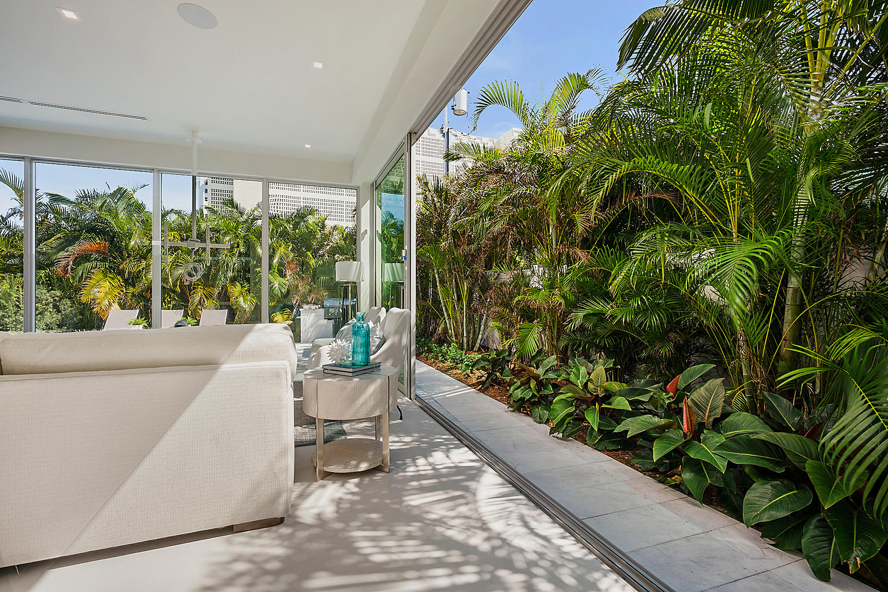 3092 Banyan Road, Unit A Boca Raton, FL 33432 - Photo 9 of 49 a living room with a garden and a plant