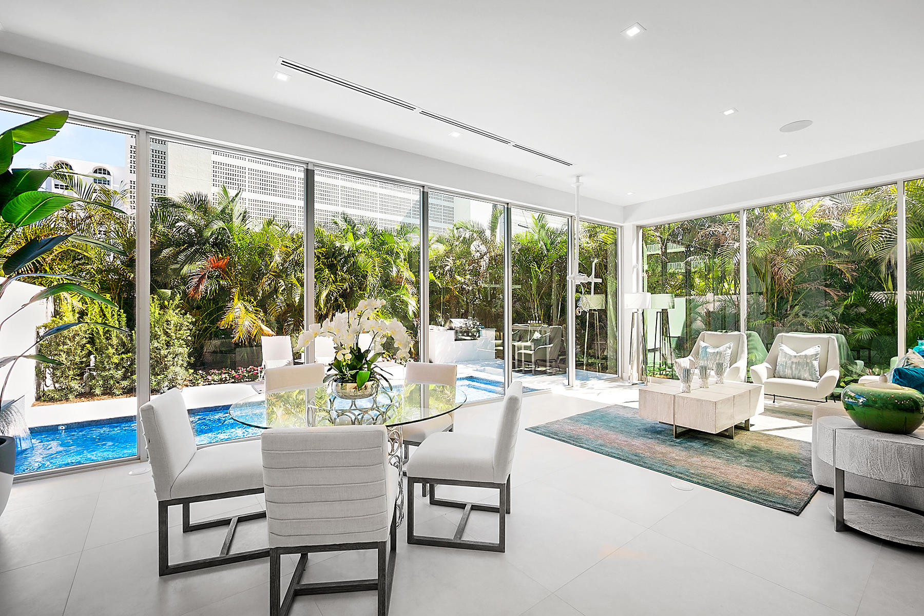 3092 Banyan Road, Unit A Boca Raton, FL 33432 - Photo 10 of 49 a dining room with furniture water view and a garden