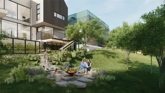 a view of backyard with plants and a lake view