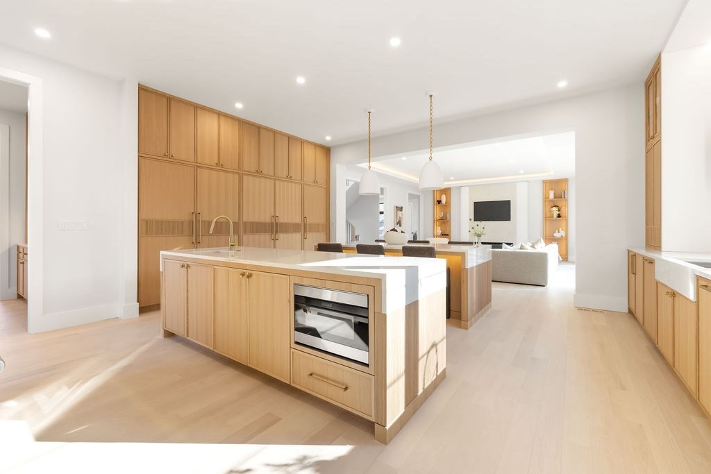 28 Cottonwood Road Newton, MA 02459 - Photo 6 of 25 a kitchen with white cabinets and white appliances