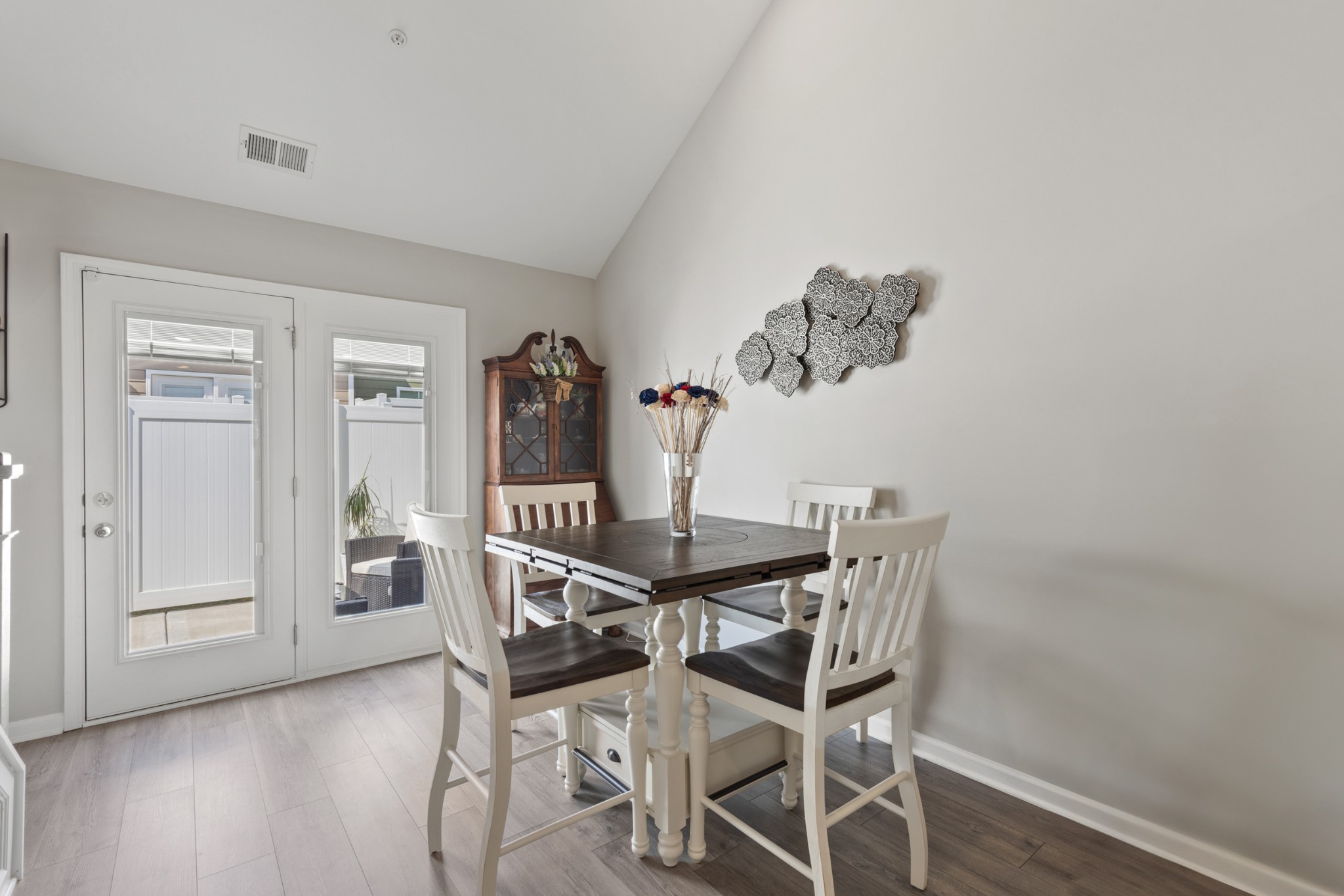 212 Addi Street Pleasant View, TN 37146 - Photo 14 of 37 a view of a dining room with furniture and wooden floor