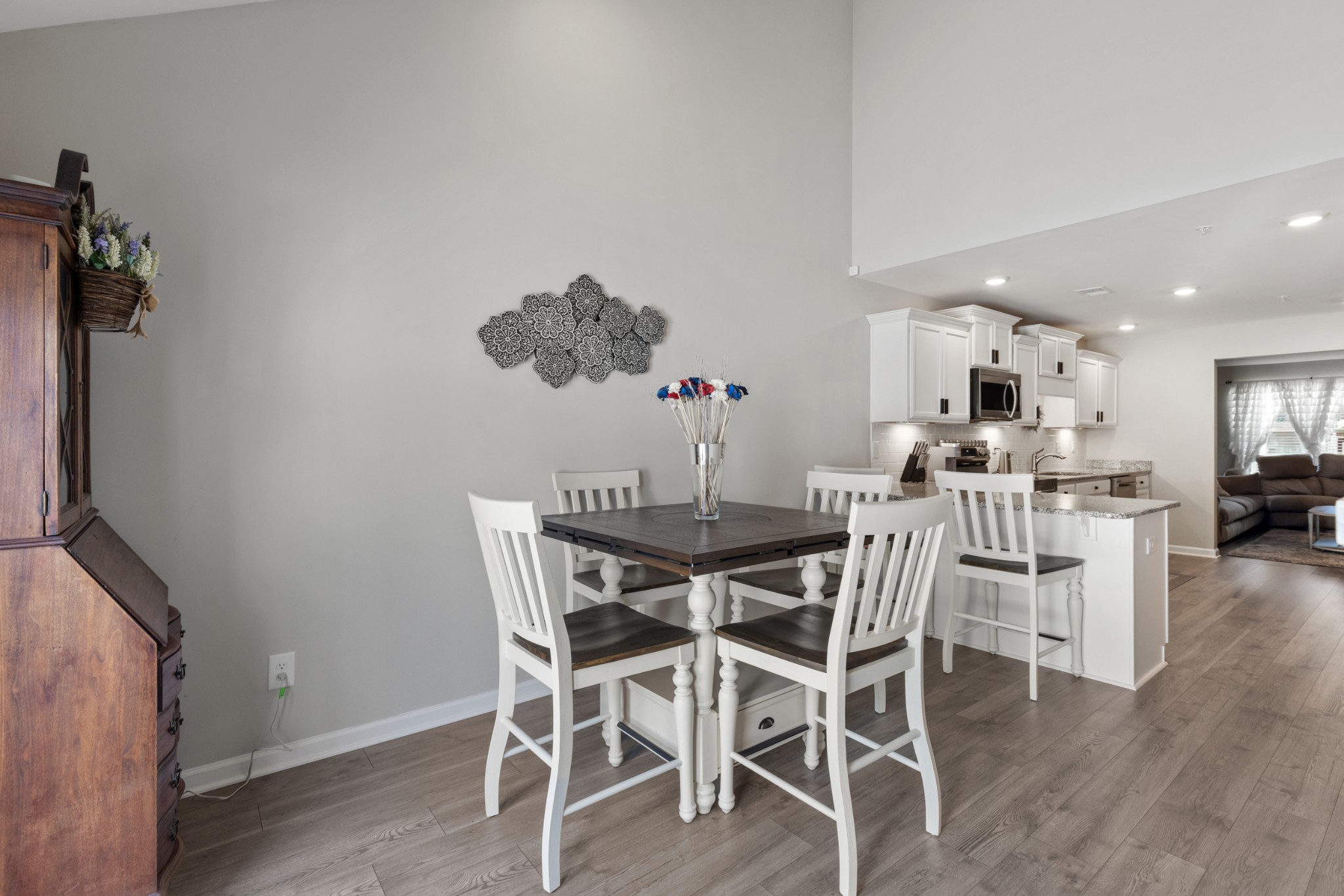 212 Addi Street Pleasant View, TN 37146 - Photo 15 of 37 a view of a dining room with furniture and wooden floor