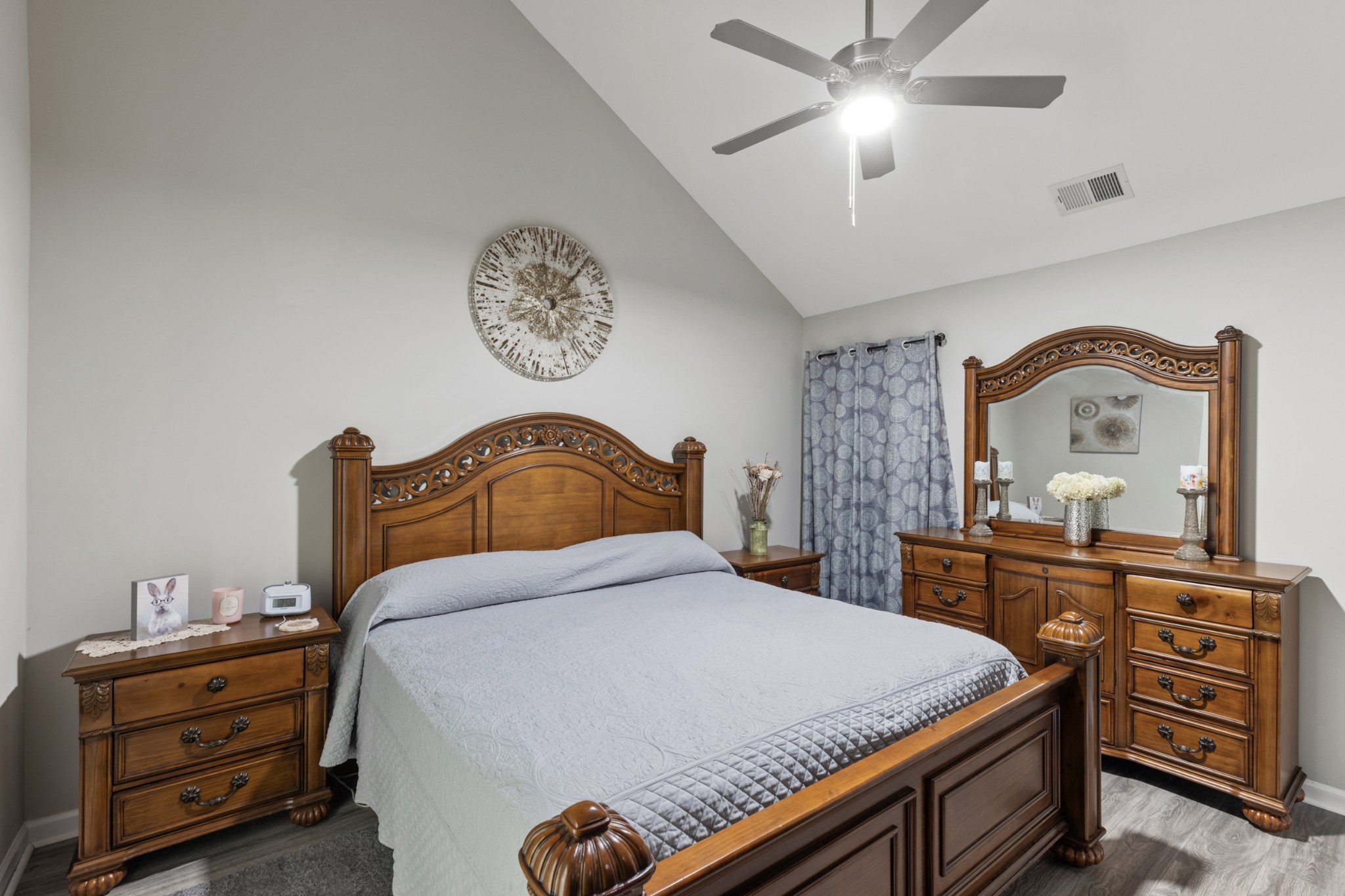 212 Addi Street Pleasant View, TN 37146 - Photo 17 of 37 a bedroom with a bed and a dresser in it