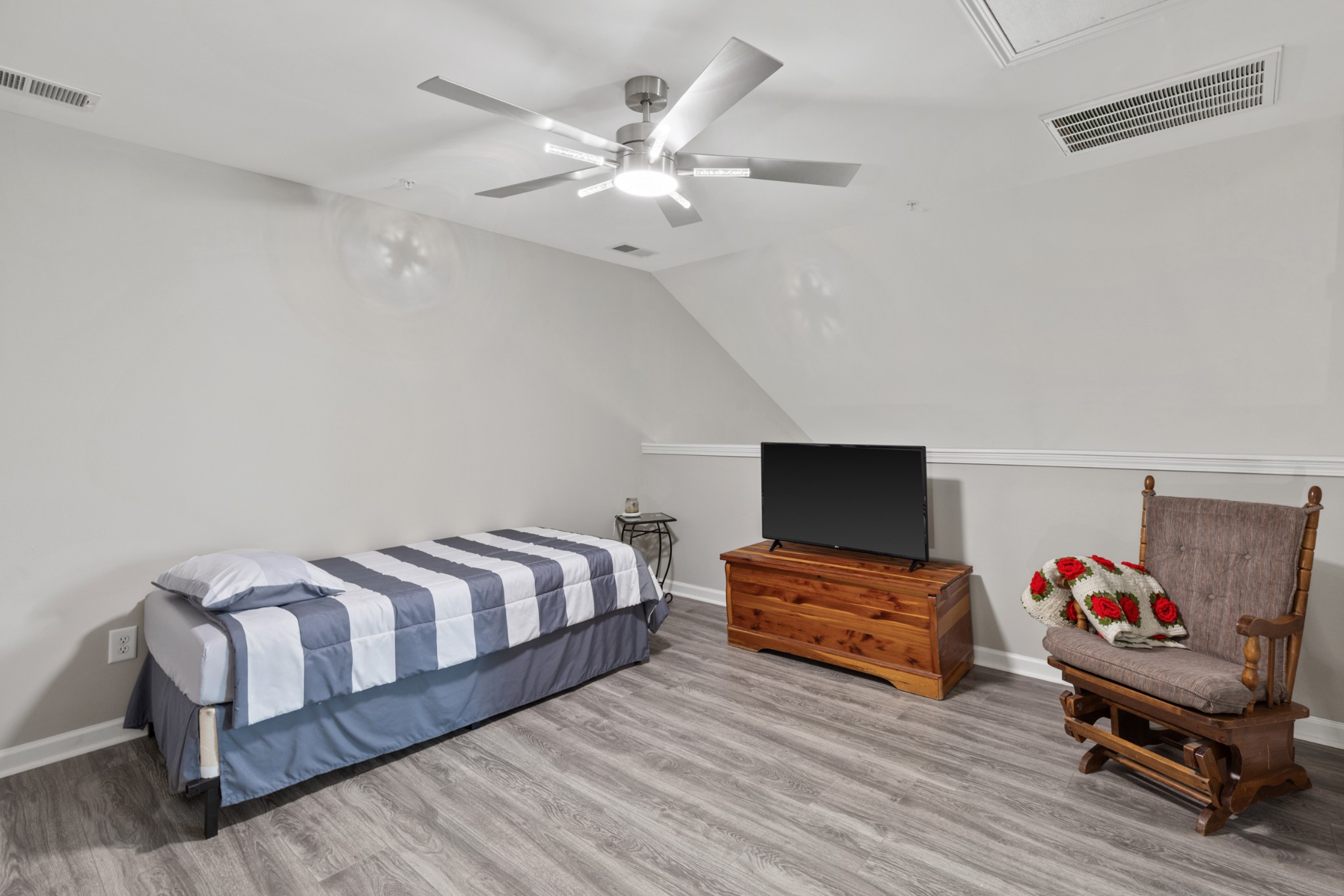 212 Addi Street Pleasant View, TN 37146 - Photo 23 of 37 a spacious bedroom with a bed and a chandelier