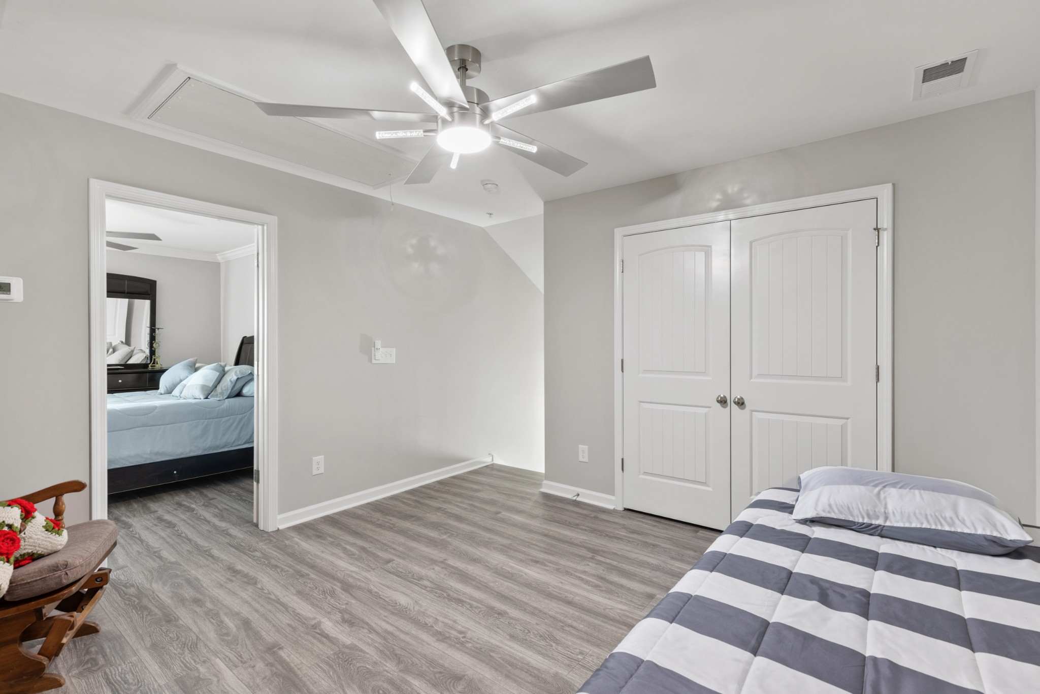 212 Addi Street Pleasant View, TN 37146 - Photo 25 of 37 a bedroom with a bed and wooden floor