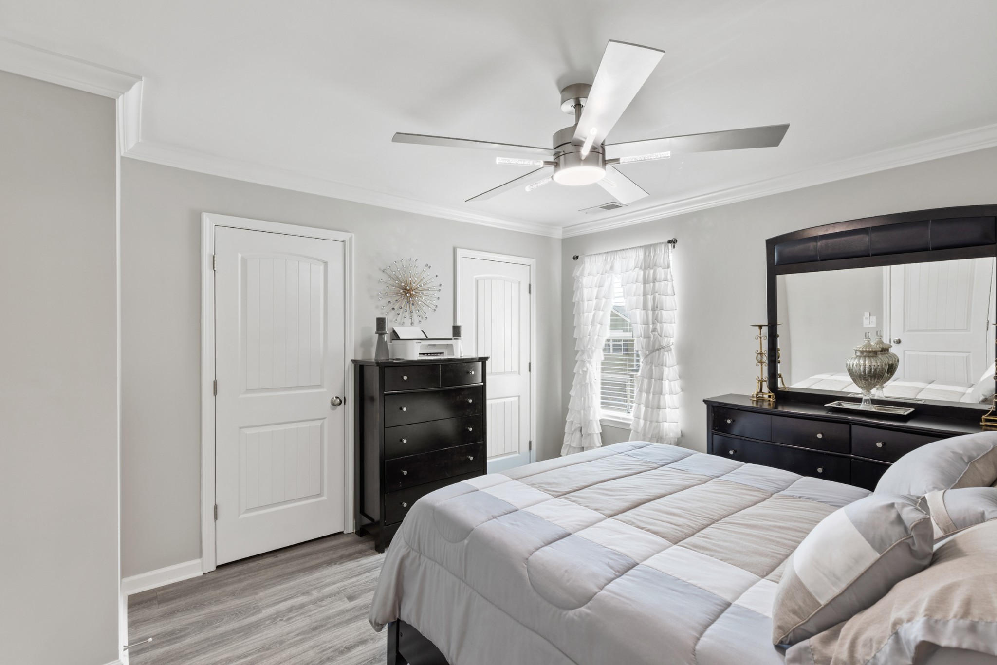 212 Addi Street Pleasant View, TN 37146 - Photo 27 of 37 a bedroom with a bed and wooden floor