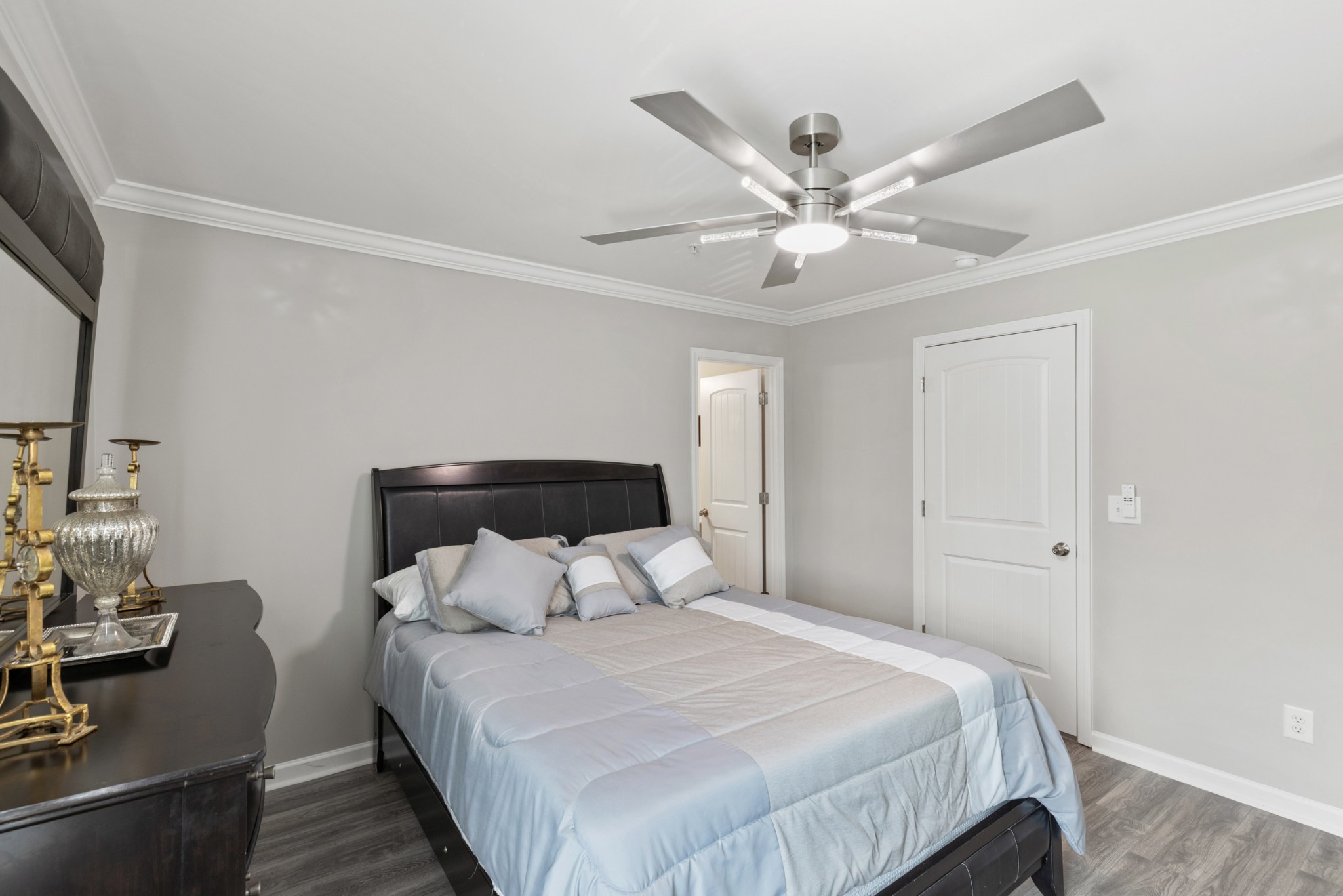 212 Addi Street Pleasant View, TN 37146 - Photo 28 of 37 a bedroom with a bed and a chandelier