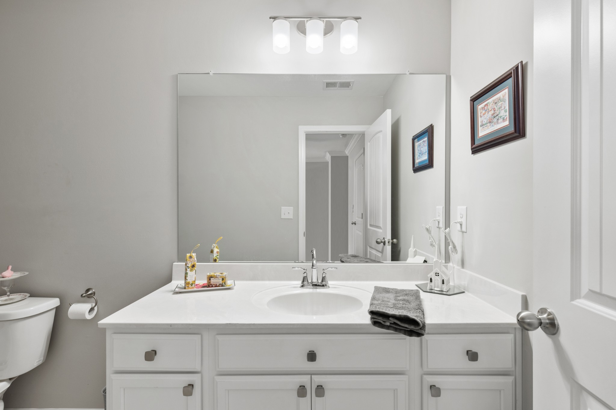 212 Addi Street Pleasant View, TN 37146 - Photo 29 of 37 a bathroom with a sink and a mirror