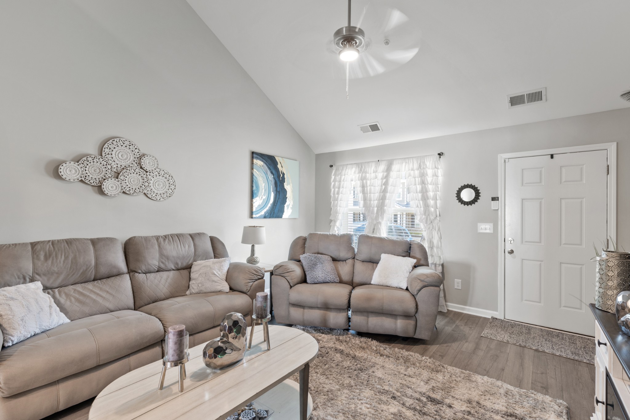 212 Addi Street Pleasant View, TN 37146 - Photo 6 of 37 a living room with furniture a couch and a chandelier