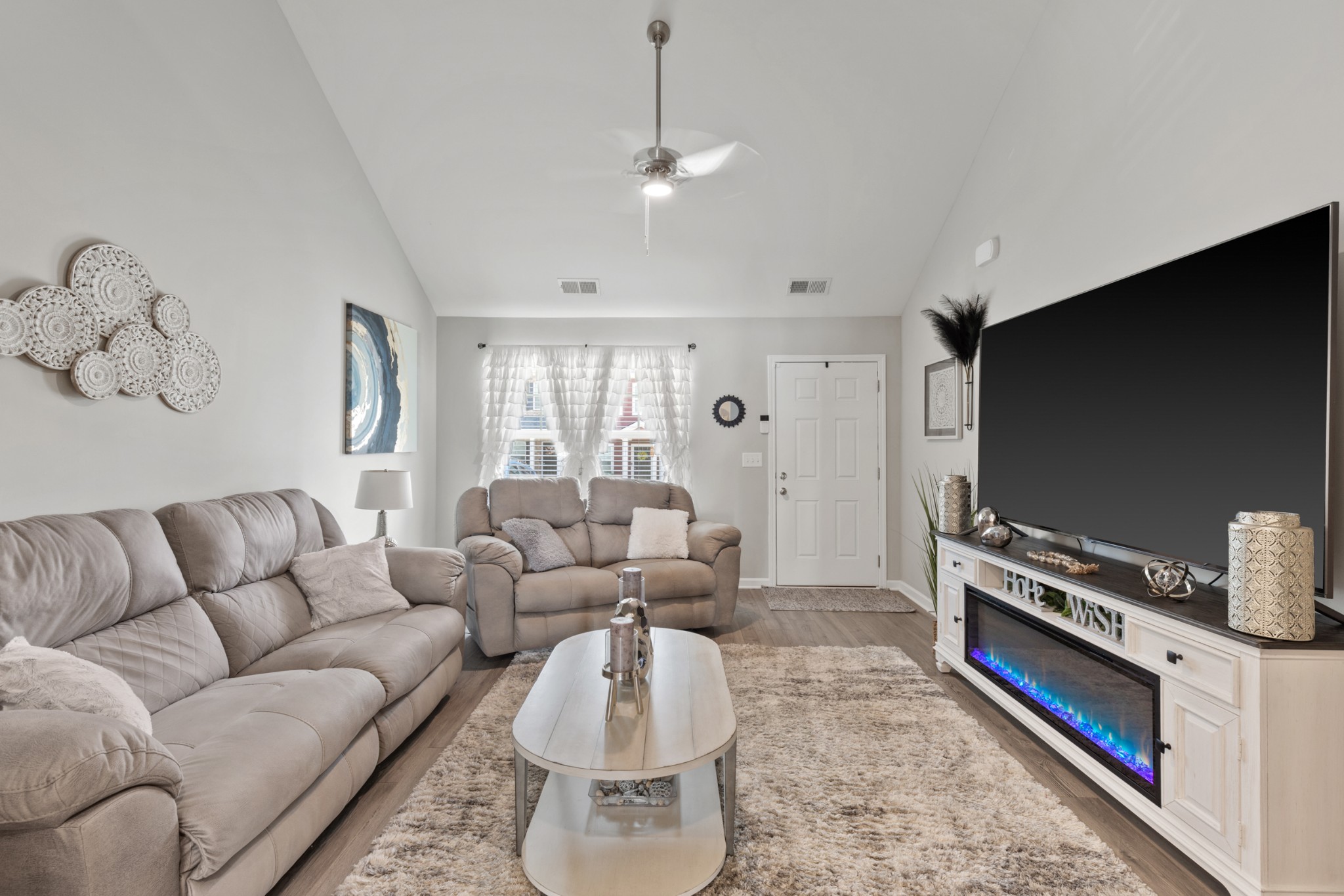 212 Addi Street Pleasant View, TN 37146 - Photo 7 of 37 a living room with furniture and a flat screen tv