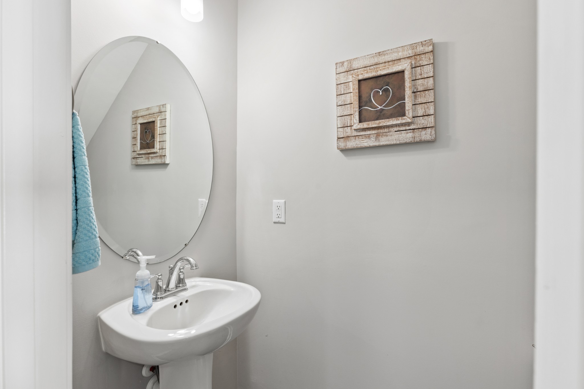 212 Addi Street Pleasant View, TN 37146 - Photo 9 of 37 a bathroom with a sink and mirror