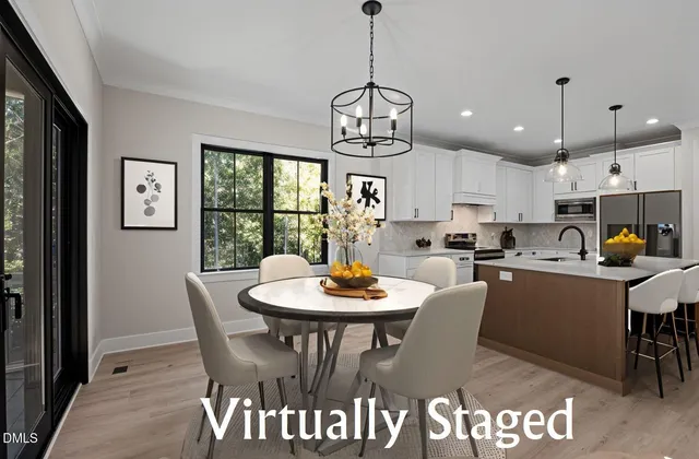 a view of a dining room with furniture window and wooden floor