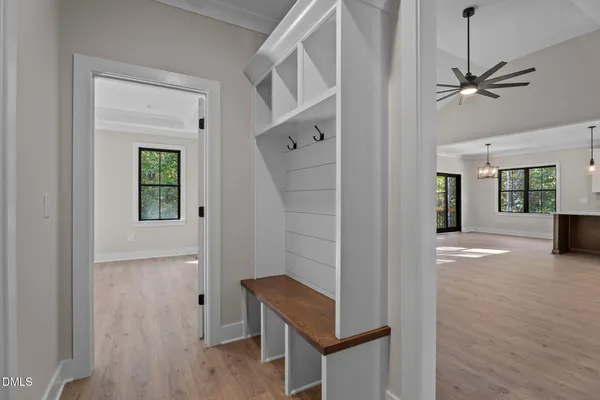 a view of an entryway with wooden floor