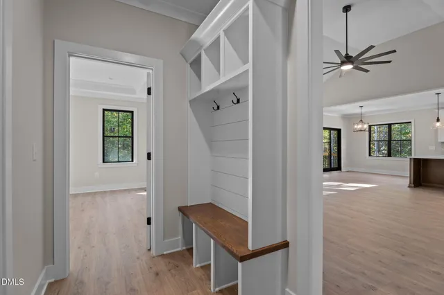 a view of an entryway with wooden floor