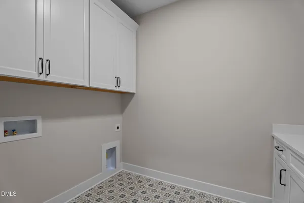 a view of storage and utility room with empty racks
