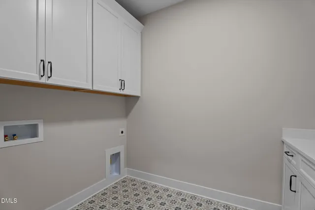 a view of storage and utility room with empty racks