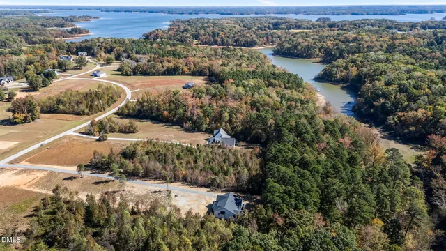 an aerial view of a houses with a yard