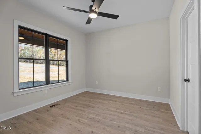 a view of a balcony with wooden floor