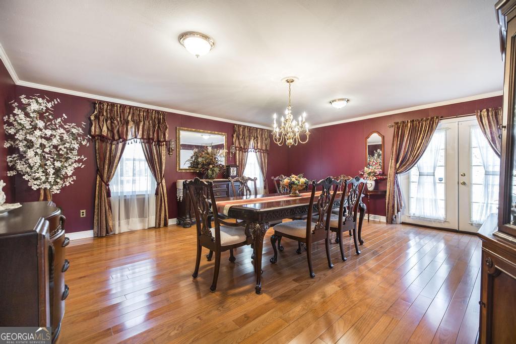 2574 Lower Hartley Bridge Road Byron, GA 31008 - Photo 15 of 45 a view of a dining room with furniture window and wooden floor