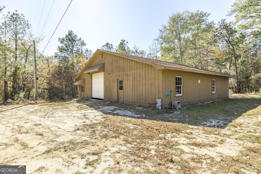 2574 Lower Hartley Bridge Road Byron, GA 31008 - Photo 30 of 45 a view of a house with a backyard