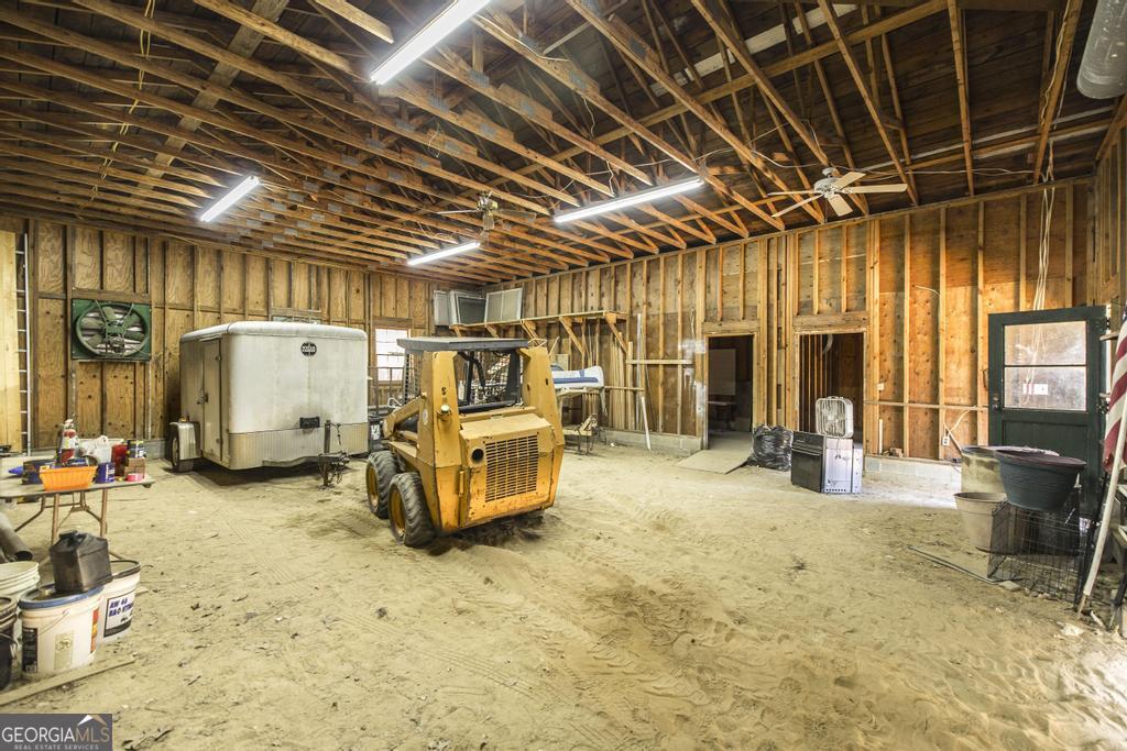 2574 Lower Hartley Bridge Road Byron, GA 31008 - Photo 32 of 45 a view of a storage room with wooden floor