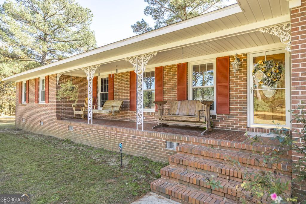 2574 Lower Hartley Bridge Road Byron, GA 31008 - Photo 5 of 45 a view of a house with backyard and sitting area