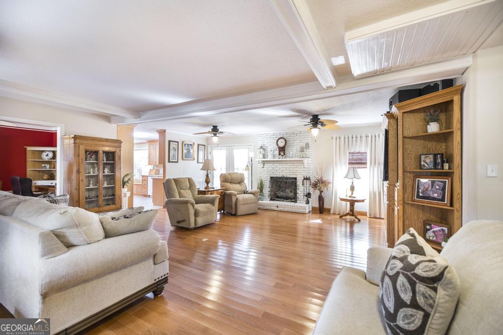 2574 Lower Hartley Bridge Road Byron, GA 31008 - Photo 6 of 45 a living room with furniture and fireplace