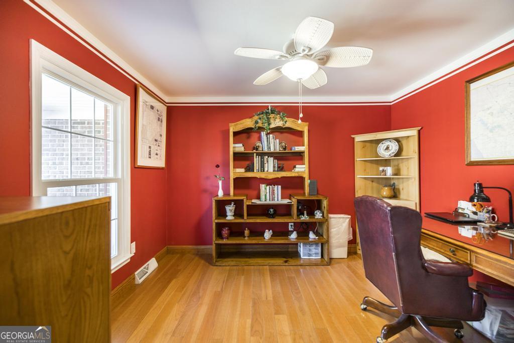 2574 Lower Hartley Bridge Road Byron, GA 31008 - Photo 9 of 45 a view of a livingroom with furniture and chandelier fan