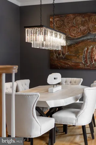 a kitchen with stainless steel appliances granite countertop a stove a sink dishwasher and cabinets with wooden floor