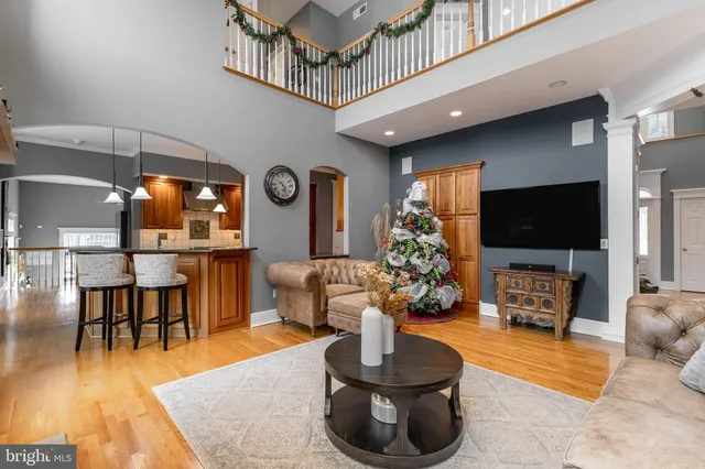 a view of a workspace with furniture and a flat screen tv