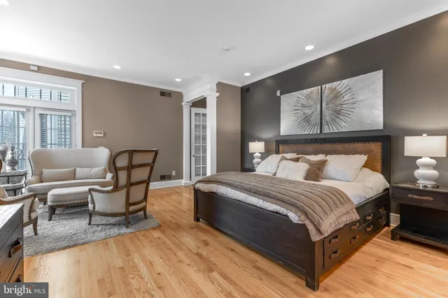 a bathroom with a granite countertop sink mirror vanity and toilet