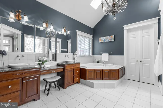 a bedroom with furniture and a book shelf