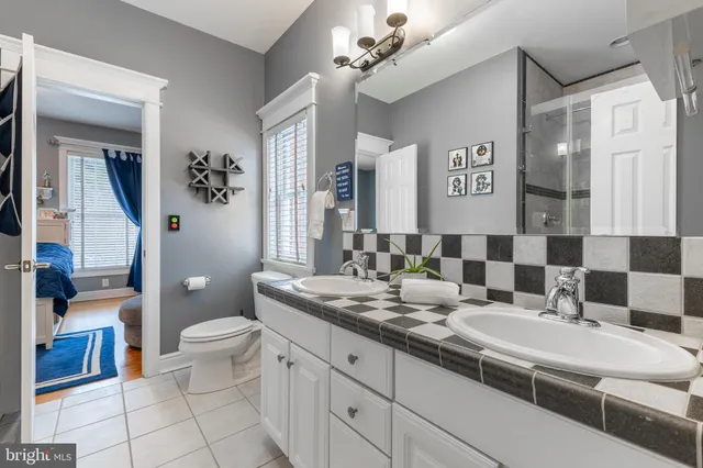 a bathroom with a toilet a sink and a shower