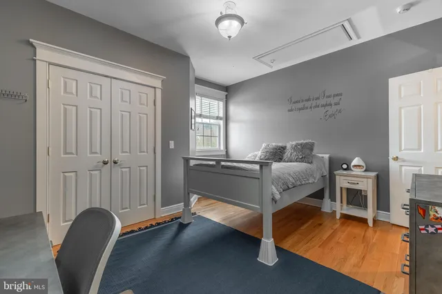 an aerial view of a house with a yard and sitting area