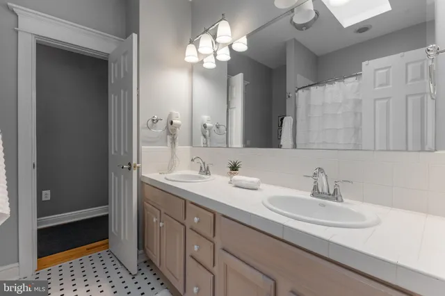 a front view of a house with plants