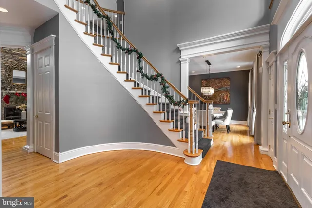 a living room with furniture a rug and a fireplace