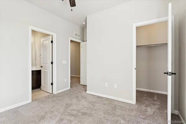 a view of an empty room with closet