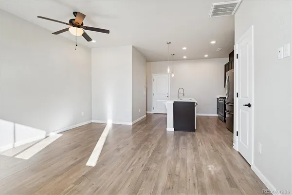 a view of a livingroom with a hardwood floor