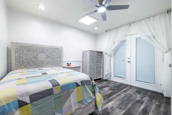 a bedroom with a bed and a table